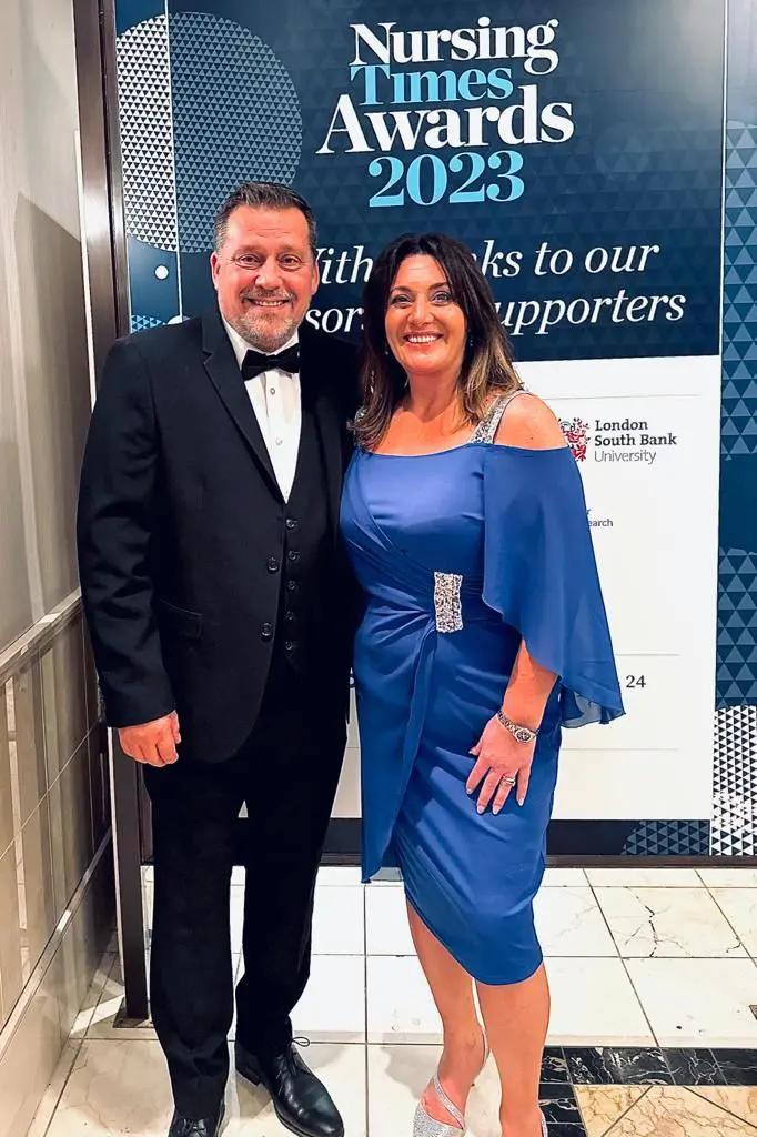 NTS Stella and Jason standing together in blue and black dress